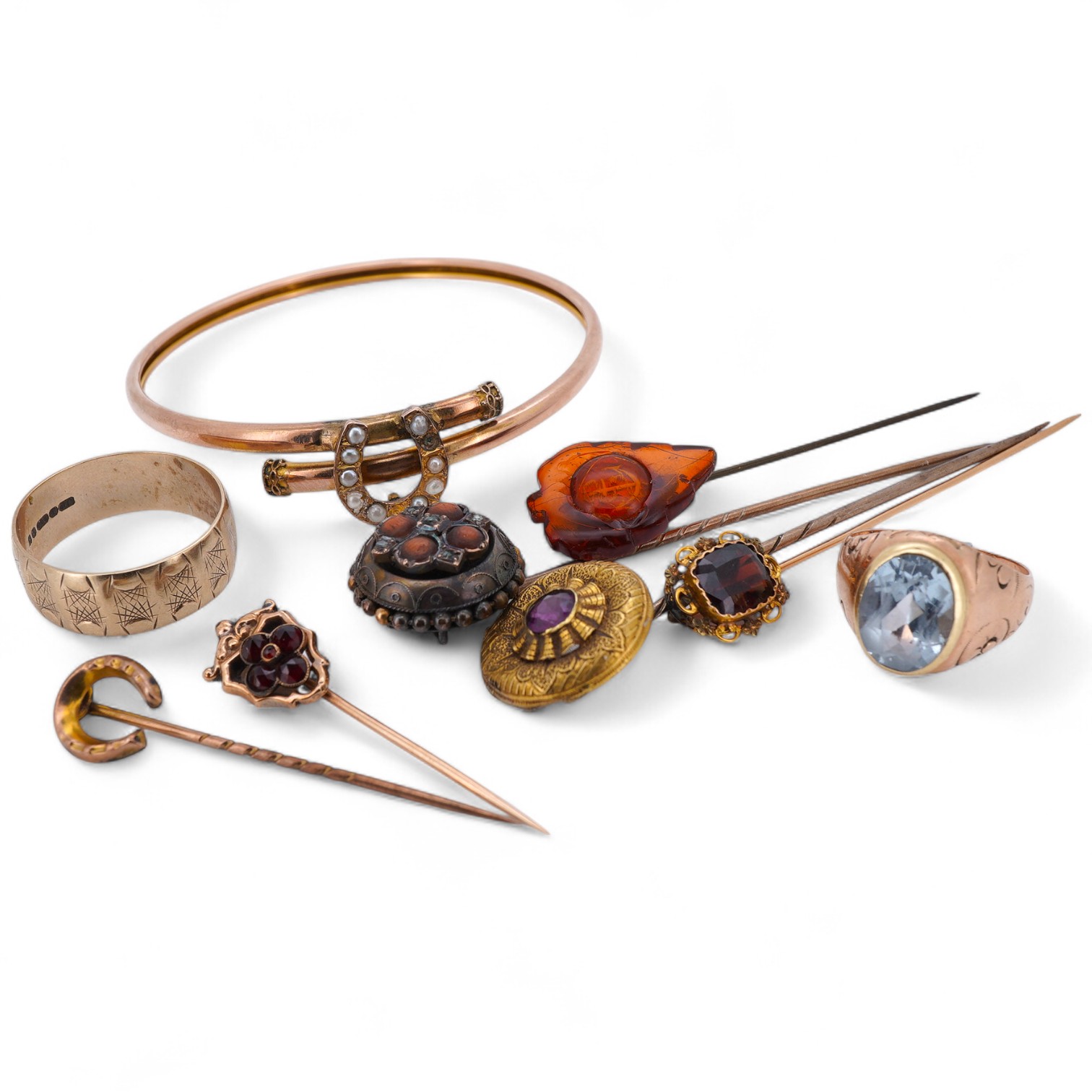 A collection of stick pins, bangle and ring, comprising: a 9ct gold and seed pearl bangle centring on a horseshoe motif, British hallmarks, gross weight 5 grams; a 9ct gold wide band ring, British hallmarks, gross weight